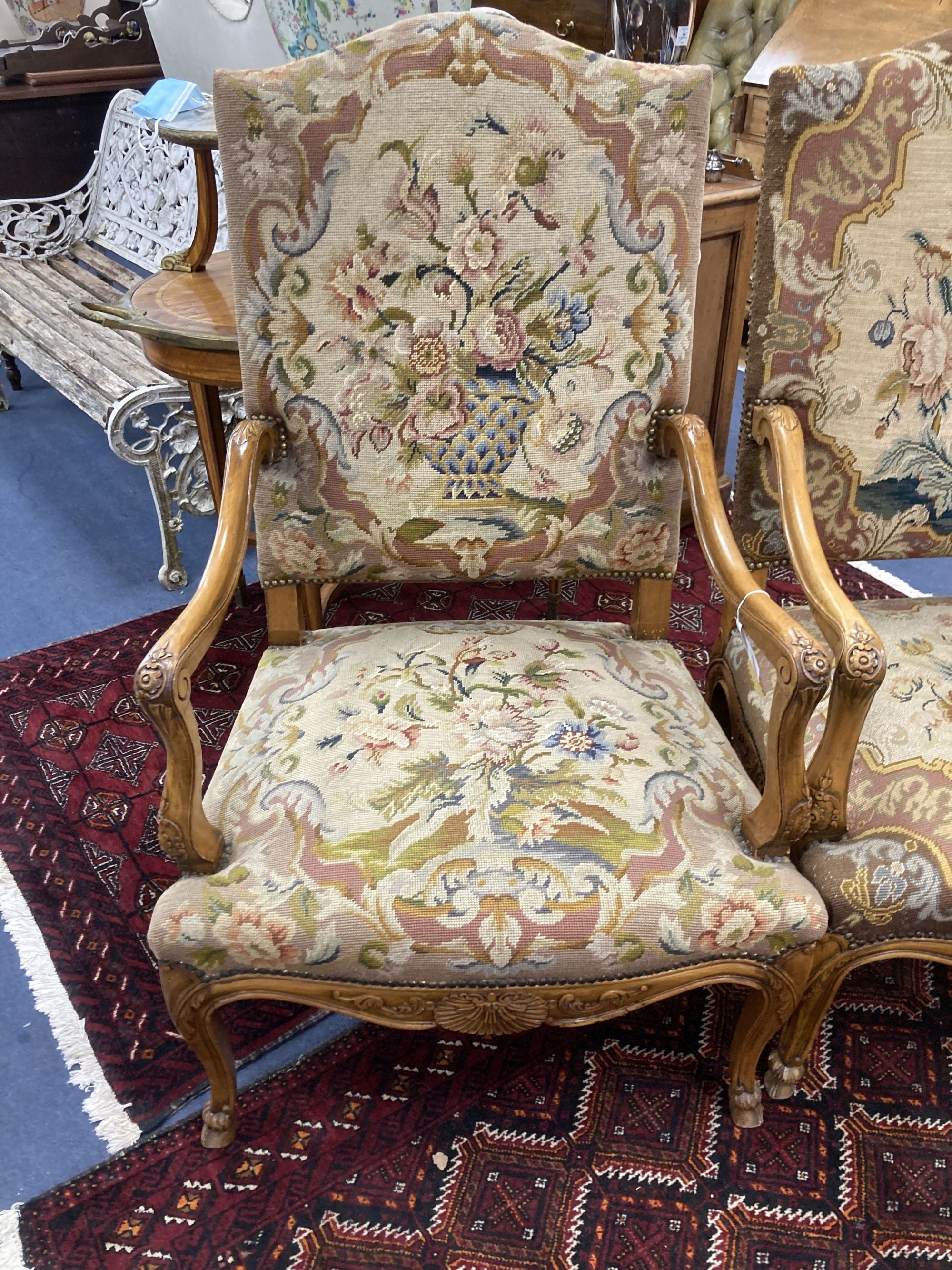 A pair of Louis XV style needlepoint armchairs, width 69cm, depth 60cm, height 110cm